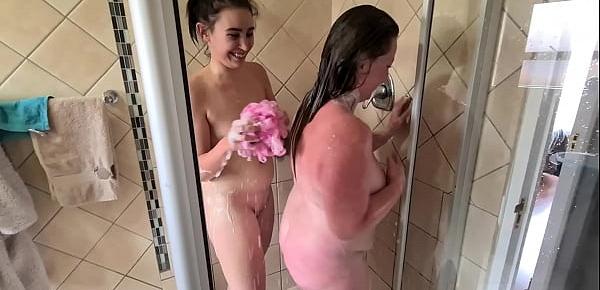  Two lesbian girls washing each other in the shower